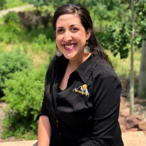 Smiling team member from the Colorado Springs electrical team, supporting customers with professionalism and care.